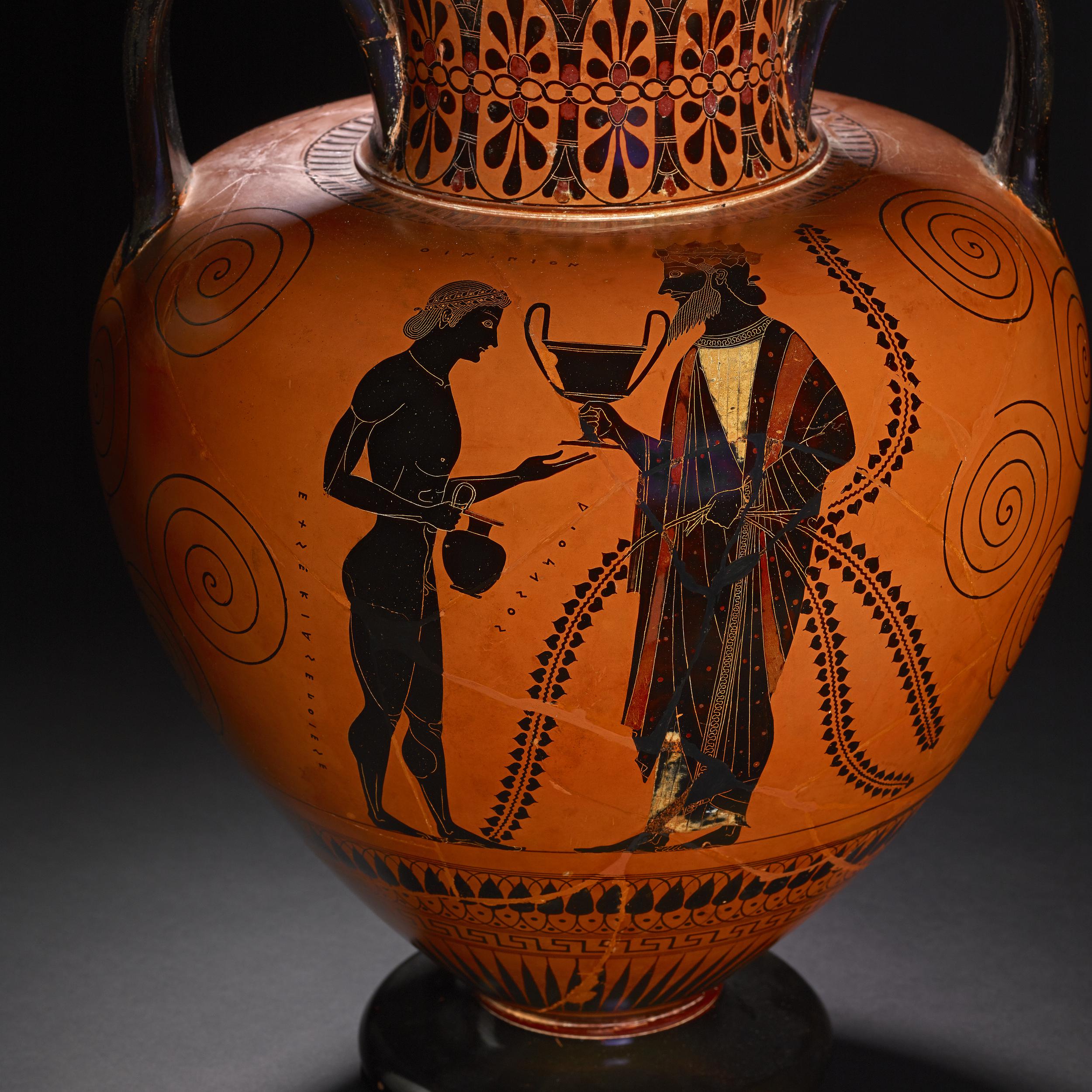 An amphora depicting the greek god Dionysos handing a cantharos to his son Oinopion
